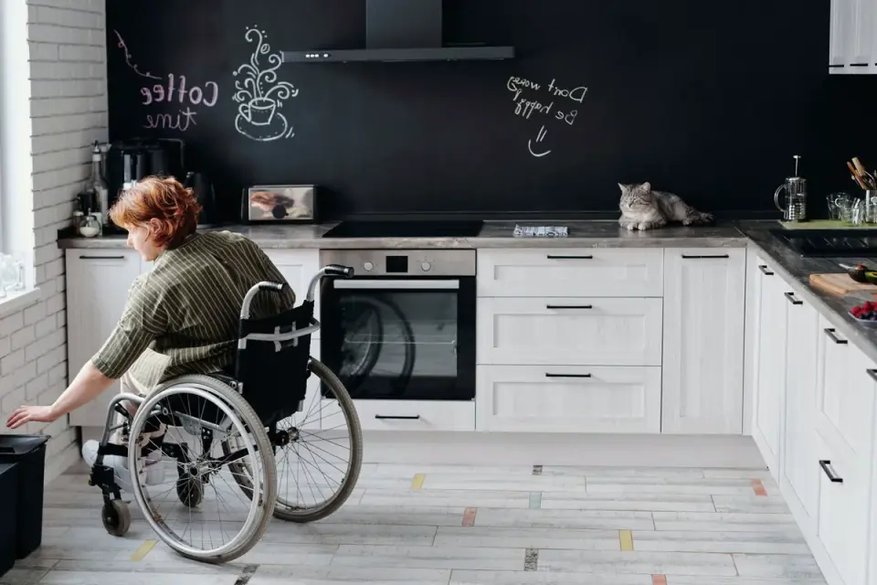 Dog in kitchen with owner