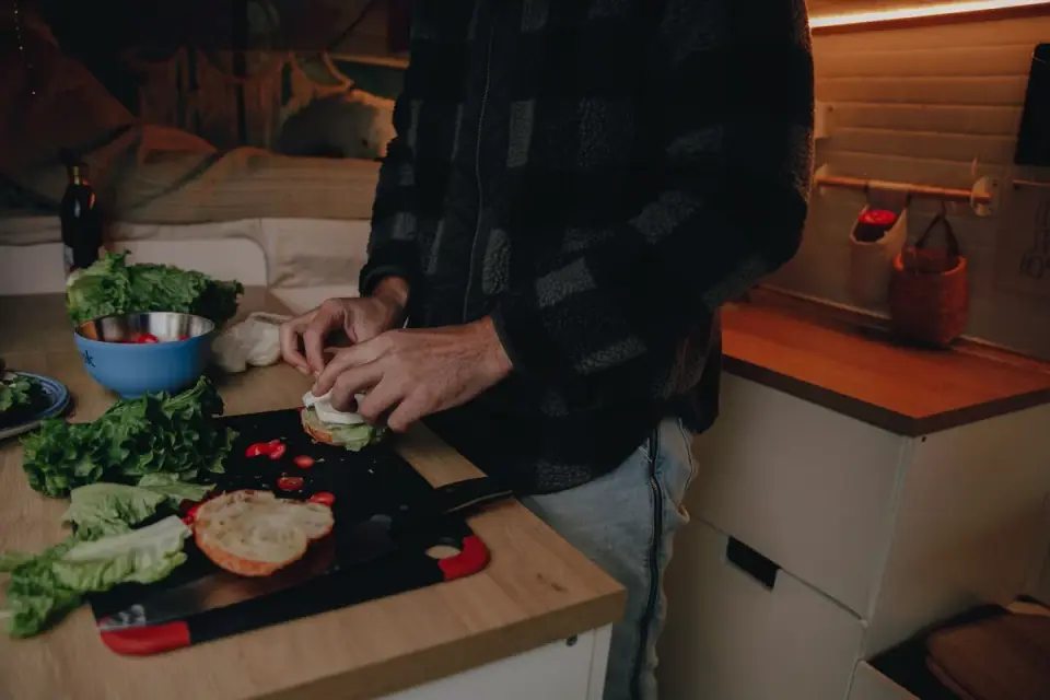 Dog owner preparing a meal